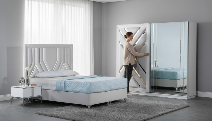Conjunto de cama blanca elegante con mesitas y armario de vidrio