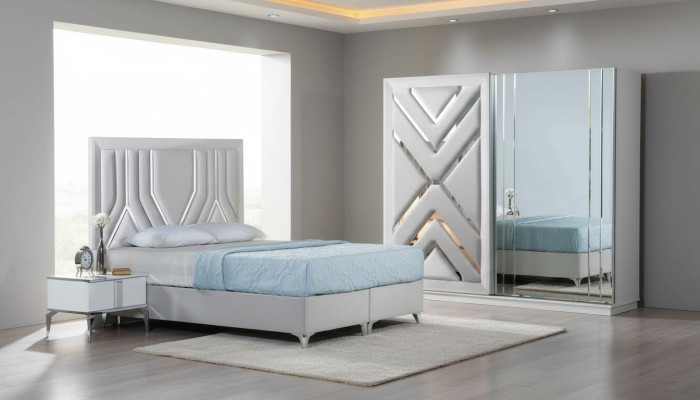 Conjunto de cama blanca elegante con mesitas y armario de vidrio