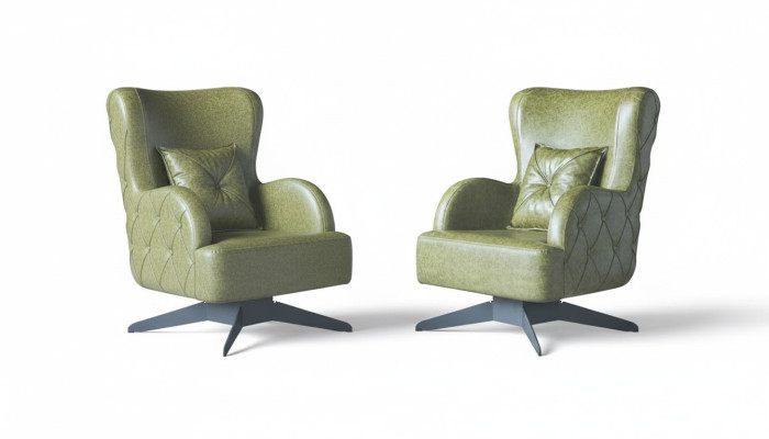 Conjunto de sillones Chesterfield verde tapizado clásico con patas de acero inoxidable y cojines de cuero.