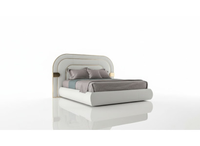 Cama gris lujosa con acentos dorados en diseño moderno y cabecera acolchada