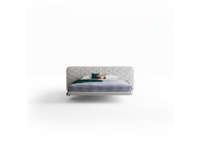 Cama tapizada blanca moderna con diseño redondo minimalista