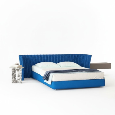 Cama de tela azul con cabecera acolchada para el dormitorio