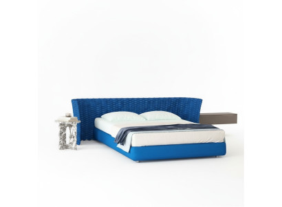 Cama de tela azul con cabecera acolchada para el dormitorio