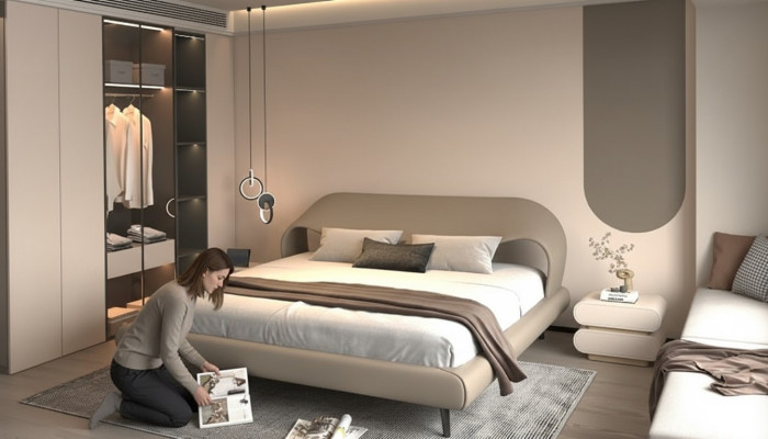 Cama gris elegante con diseño minimalista y redondeado