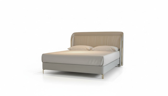 Moderna cama de lujo en gris con un elegante cabecero dorado