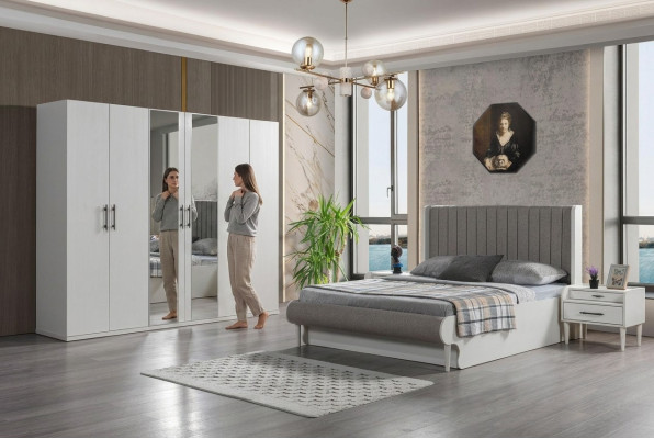 Moderno dormitorio de 4 piezas con cama, armario y mesitas de noche