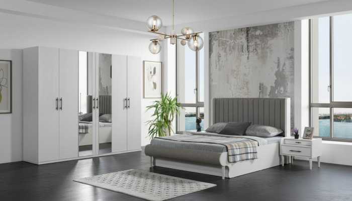 Moderno dormitorio de 4 piezas con cama, armario y mesitas de noche