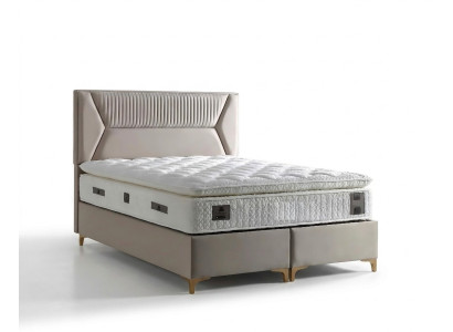 Cama elegante beige con colchón de textil y madera