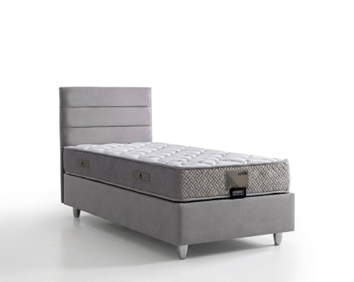 Elegante cama gris con colchón de textil y madera
