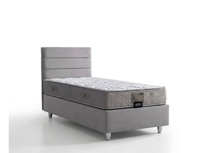 Elegante cama gris con colchón de textil y madera