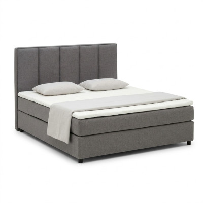 Cama con somier de caja continental acolchada doble de cuero textil.